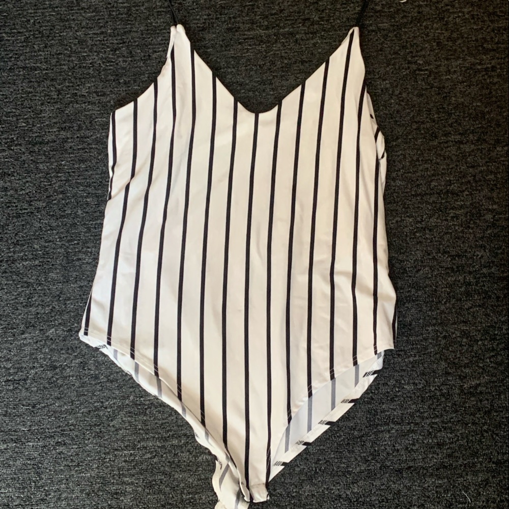 Three of the same style bodysuits in three different colors. All the same size